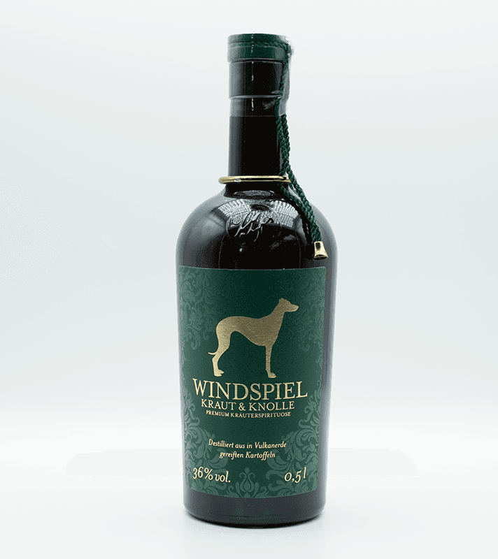 Dunkle Flasche mit der Schrift Windspiel Kraut Knolle vor einem weißen Hintergrund.